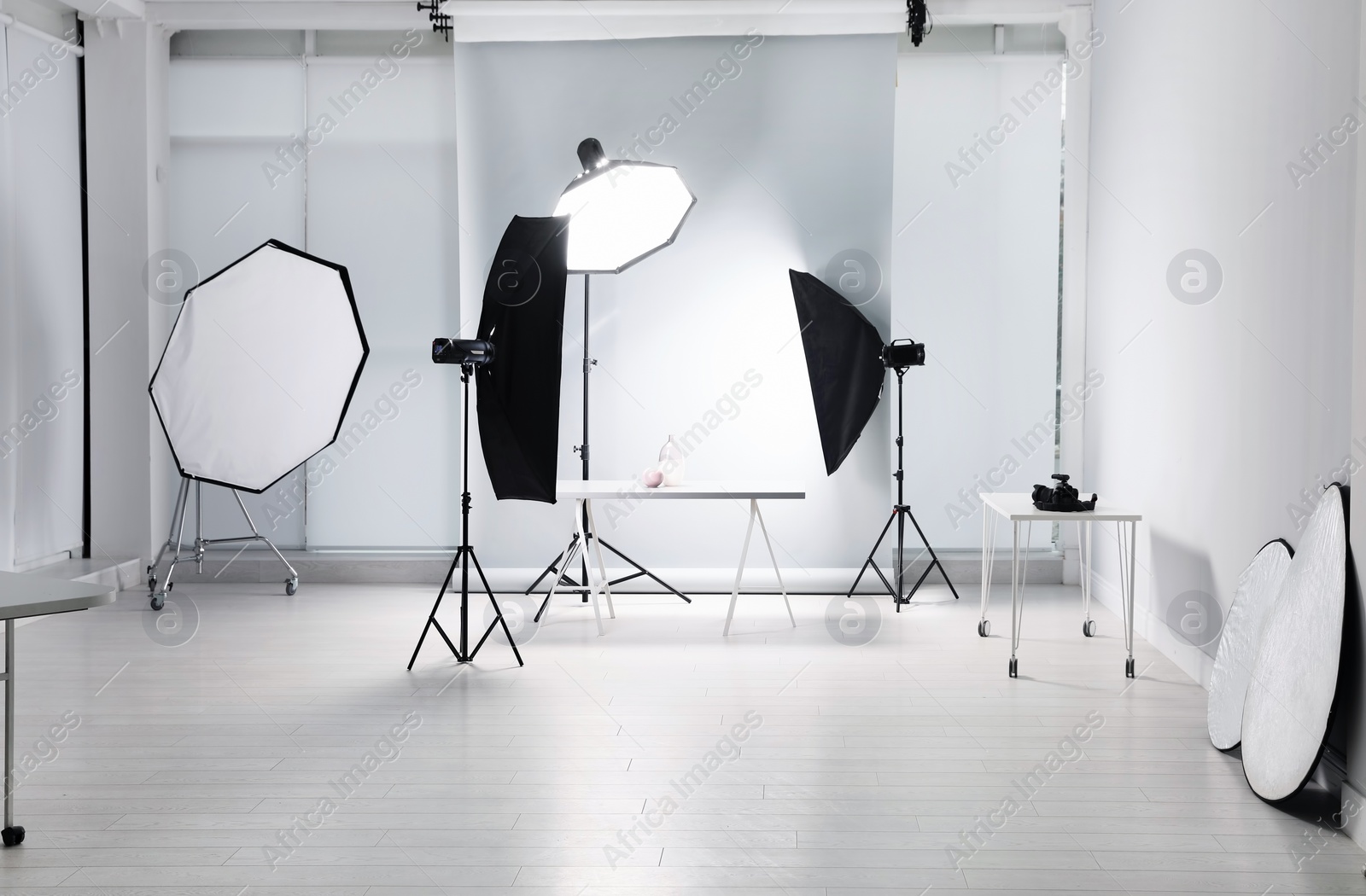 Photo of Interior of modern photo studio with professional equipment