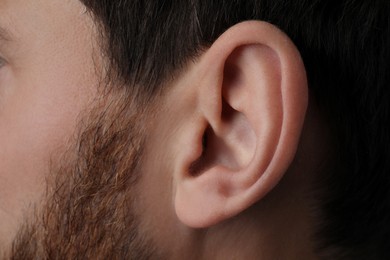 Photo of Closeup view of man, focus on ear