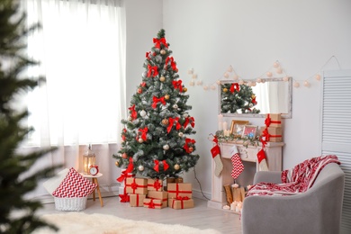 Photo of Stylish living room interior with decorated Christmas tree