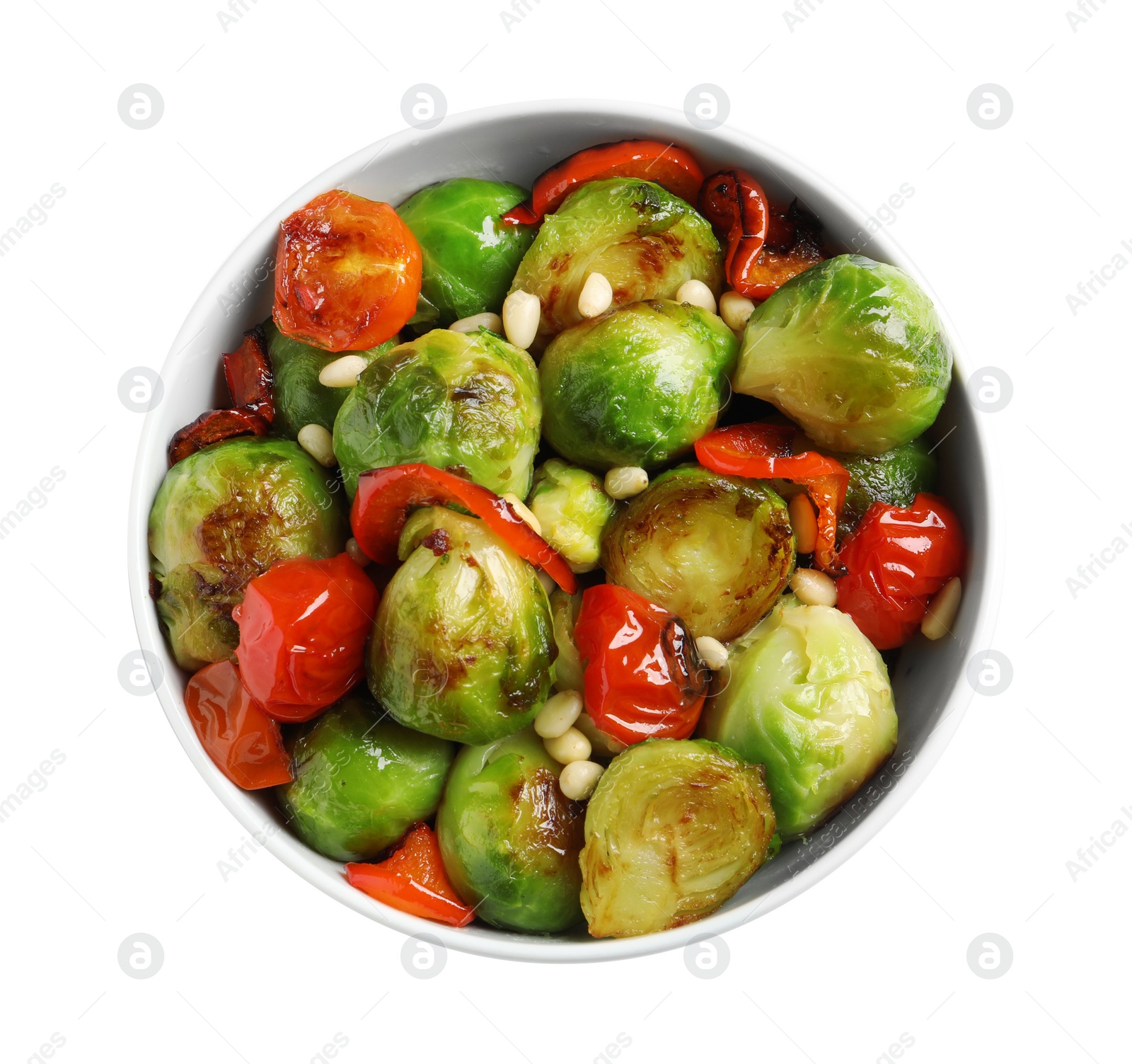 Photo of Bowl of salad with Brussels sprouts isolated on white, top view