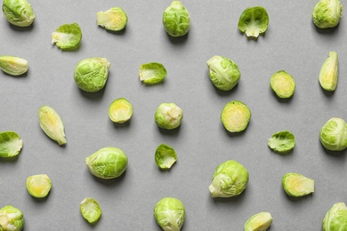 Photo of Tasty fresh Brussels sprouts on grey background, top view