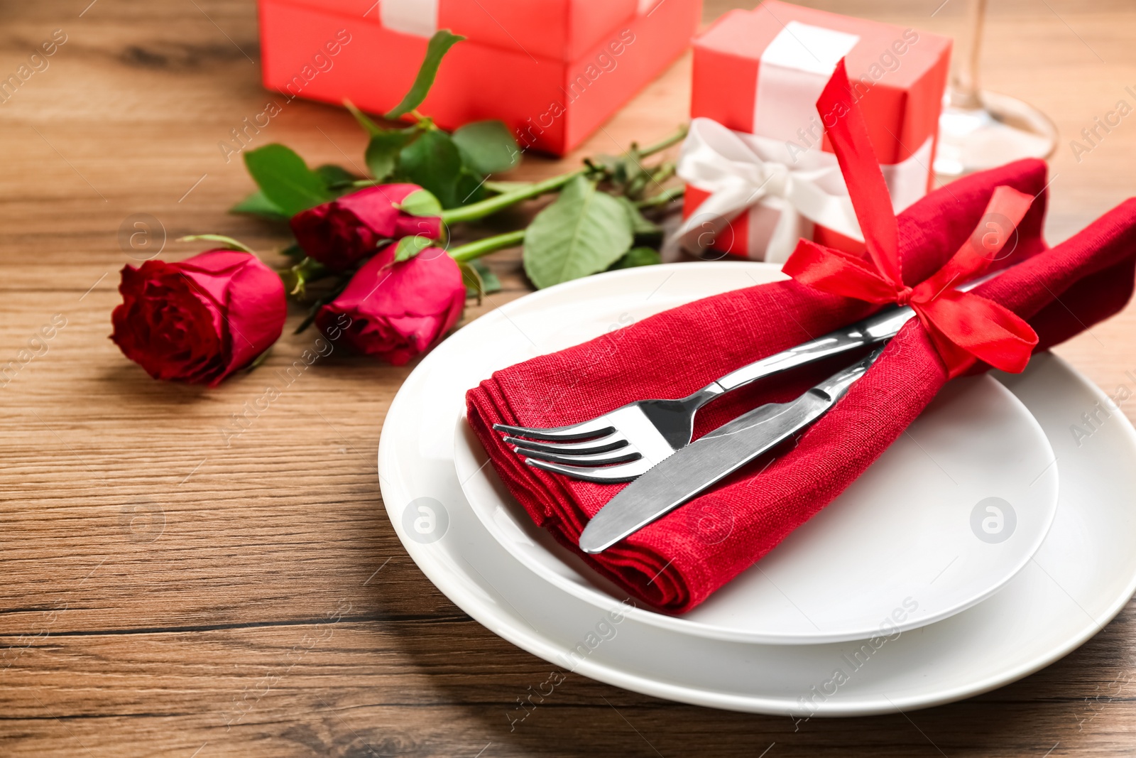 Photo of Beautiful table setting for Valentine's Day dinner on wooden background, closeup