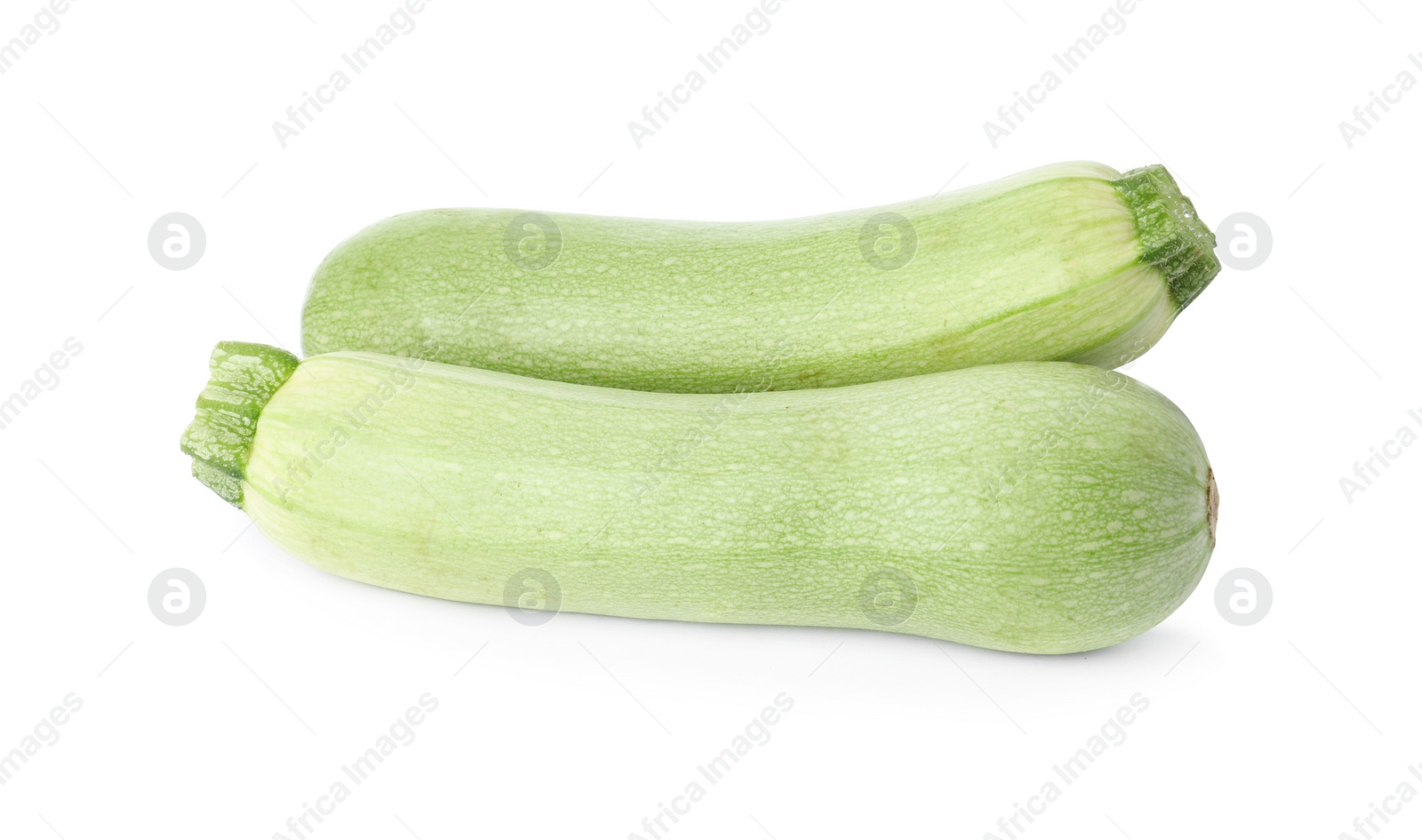 Photo of Raw green ripe zucchinis isolated on white