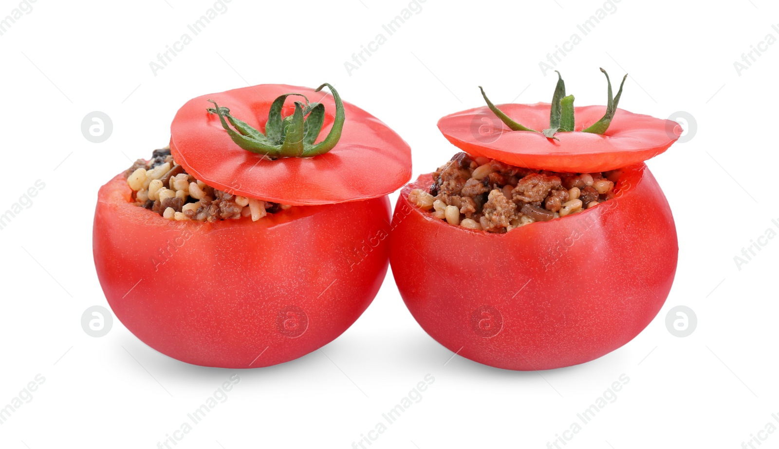 Photo of Delicious stuffed tomatoes with minced beef, bulgur and mushrooms isolated on white