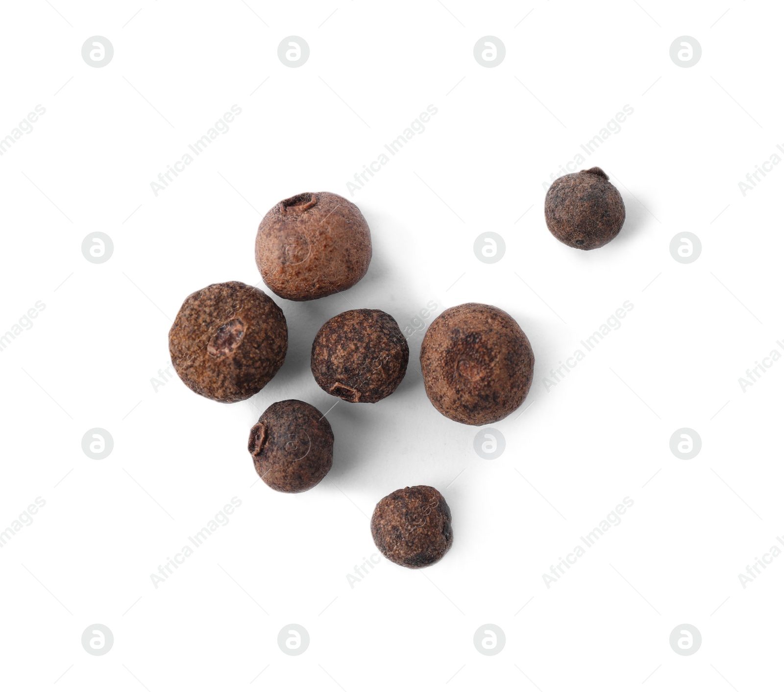 Photo of Black pepper grains on white background, top view