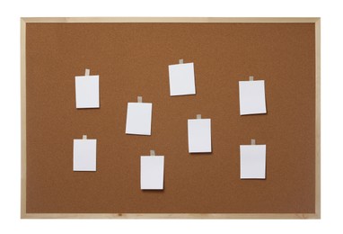 Blank paper notes on cork board against white background