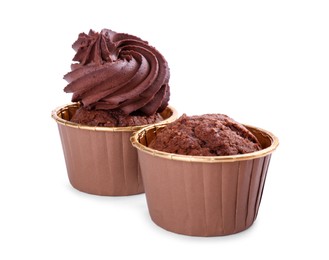 Photo of Two delicious chocolate cupcakes isolated on white