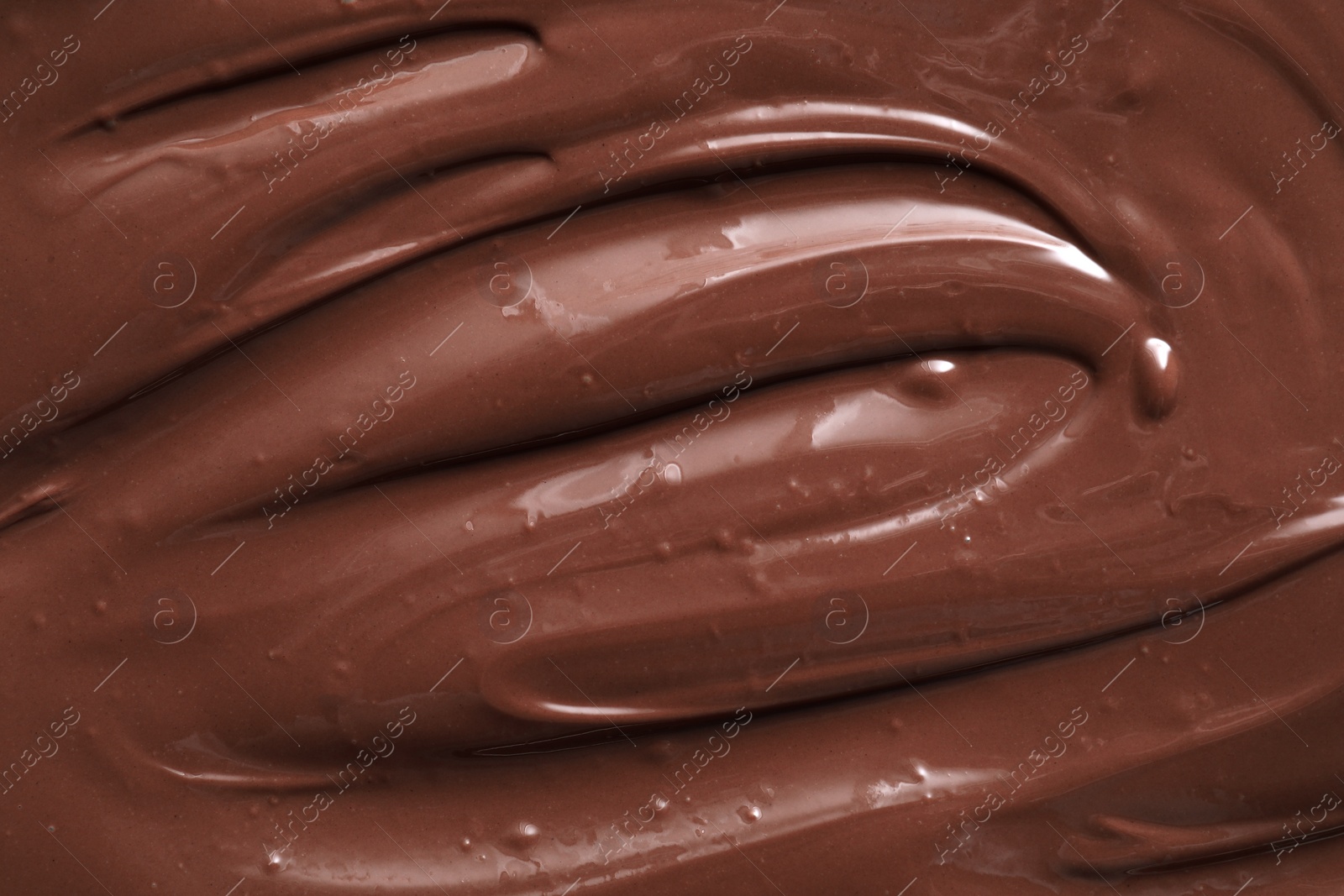 Photo of Tasty chocolate paste as background, closeup view