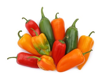 Different hot chili peppers isolated on white, top view
