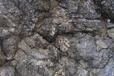 Photo of Textured of old stone surface as background, closeup