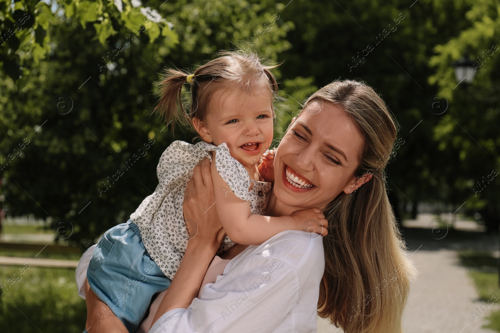 Photo of Happy mother with her daughter spending time together in park