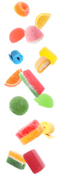 Image of Different delicious candies falling on white background