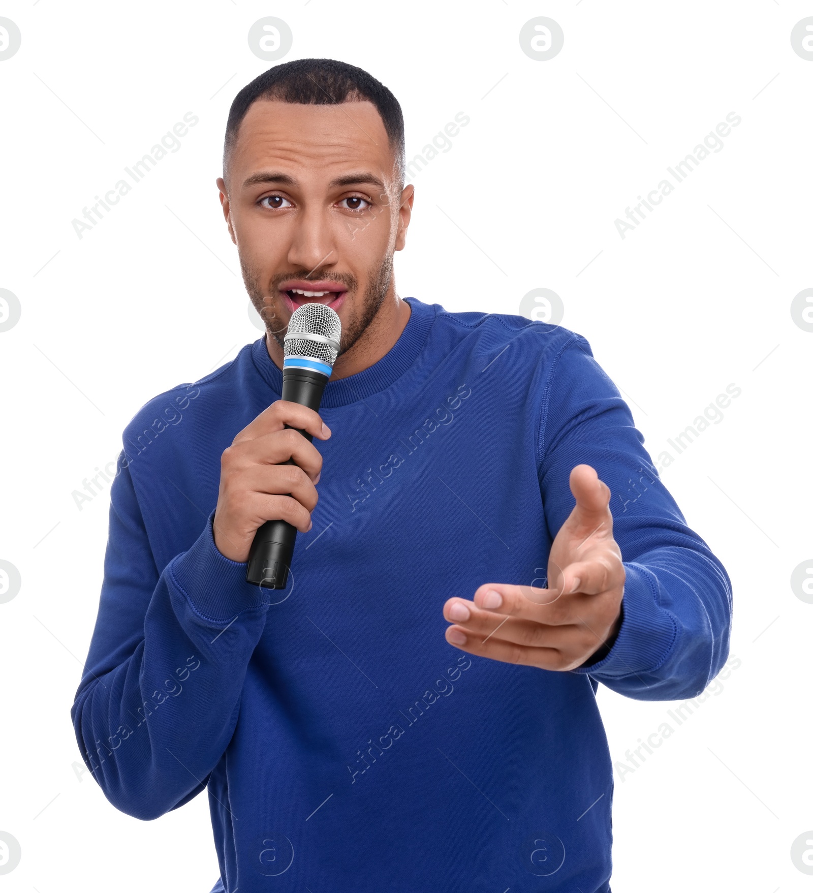 Photo of Handsome man with microphone singing on white background