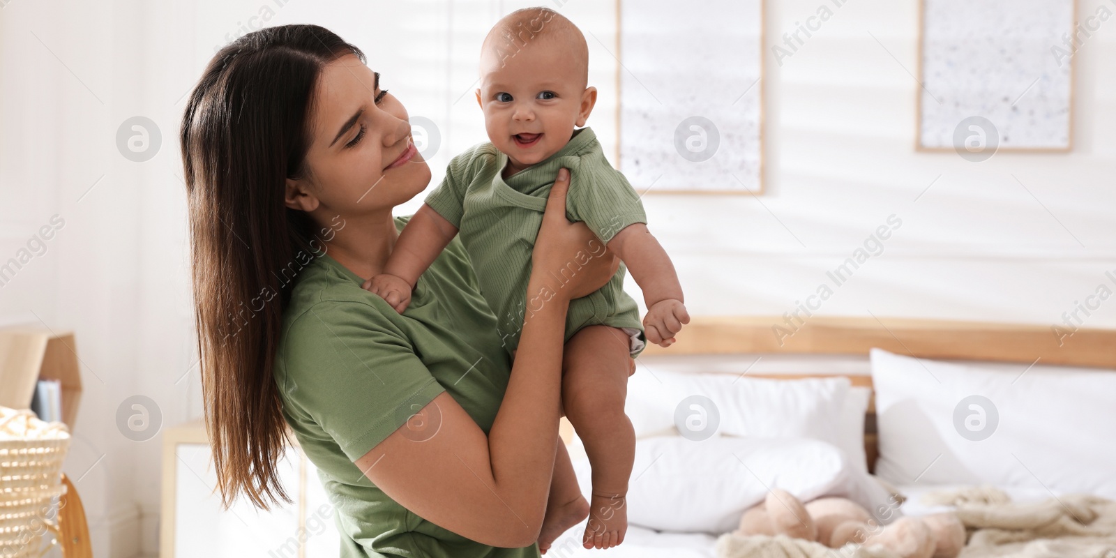 Image of Mother with her cute baby at home. Banner design 