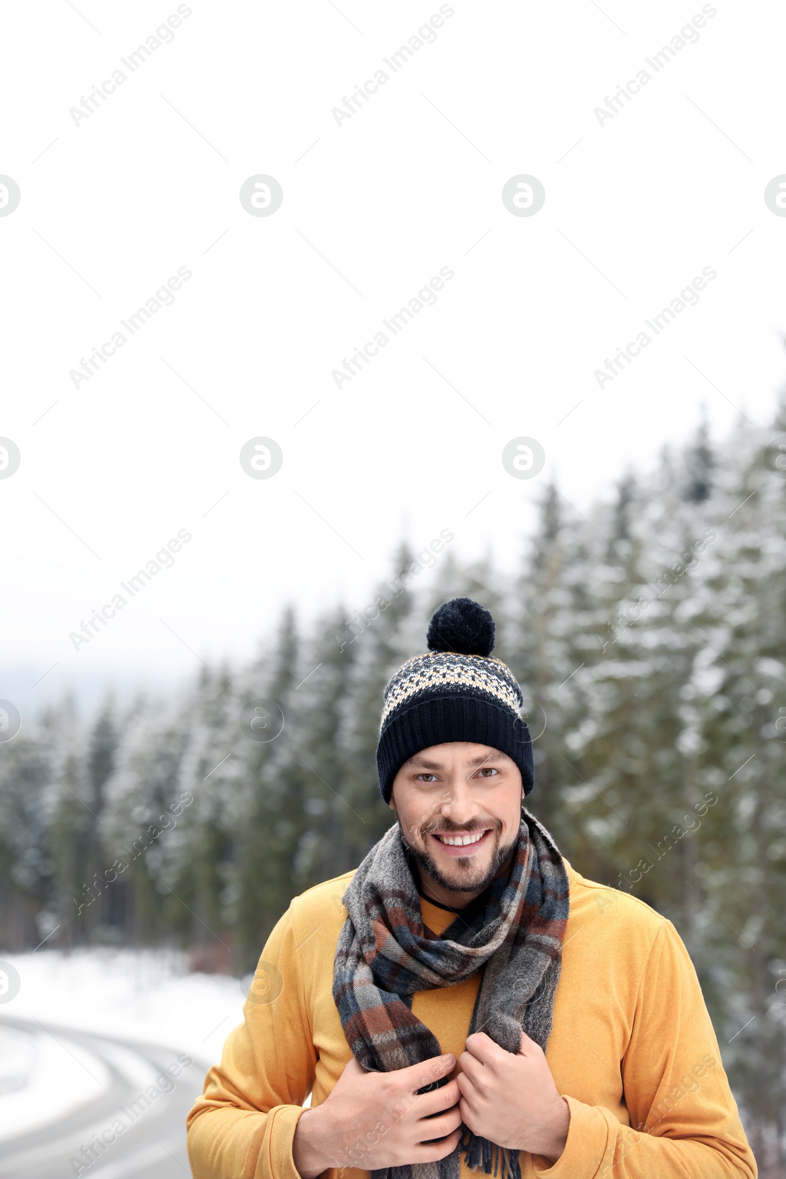 Photo of Man in warm clothes outdoors. Winter vacation