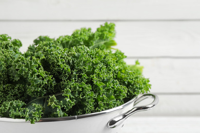 Photo of Fresh kale leaves against white background, closeup