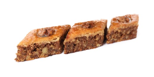 Photo of Delicious honey baklava with walnuts on white background