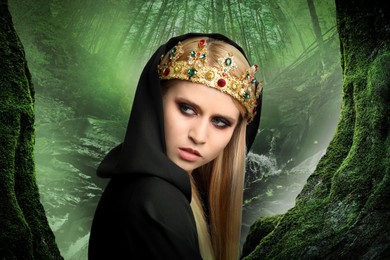 Witch wearing black mantle and crown in misty forest. Scary fantasy character