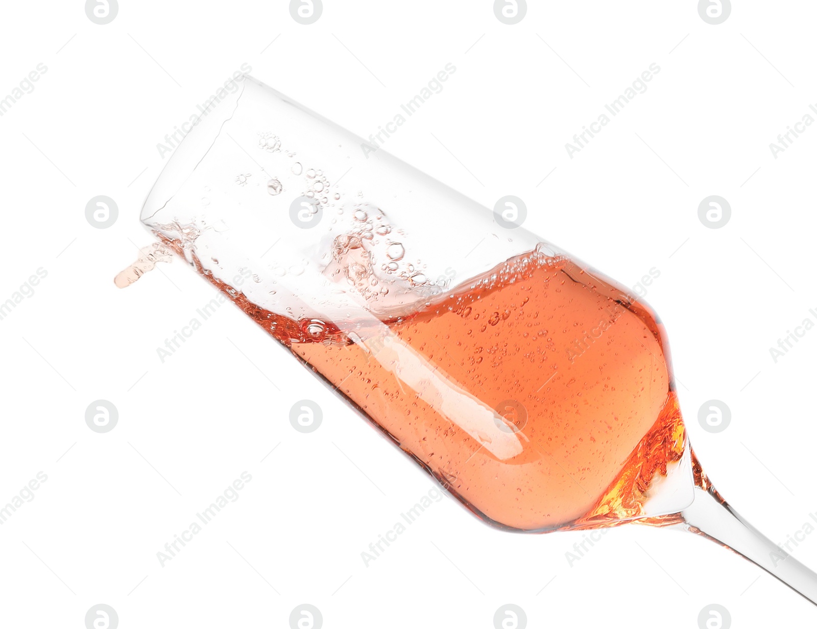 Photo of Glass of rose champagne isolated on white