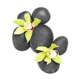 Photo of Beautiful orchid flowers with spa stones on white background, top view