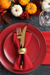 Photo of Happy Thanksgiving day. Beautiful table setting and autumn decoration on black background, flat lay