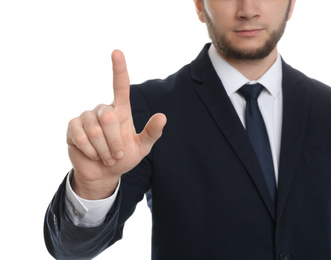 Businessman touching something against white background, focus on hand