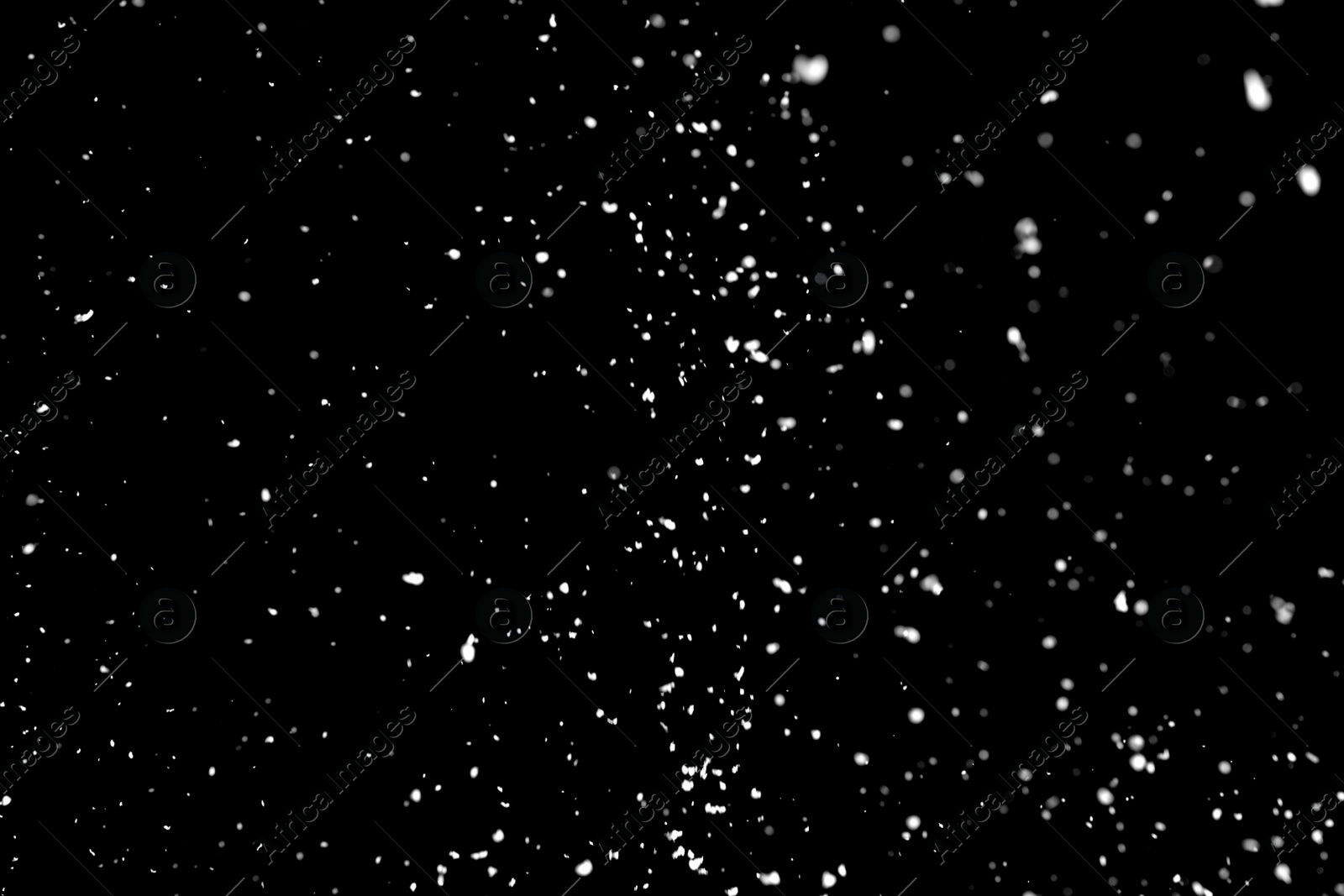 Photo of White snow falling down on black background