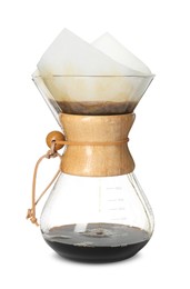 Photo of Glass chemex coffeemaker with paper filter and coffee isolated on white