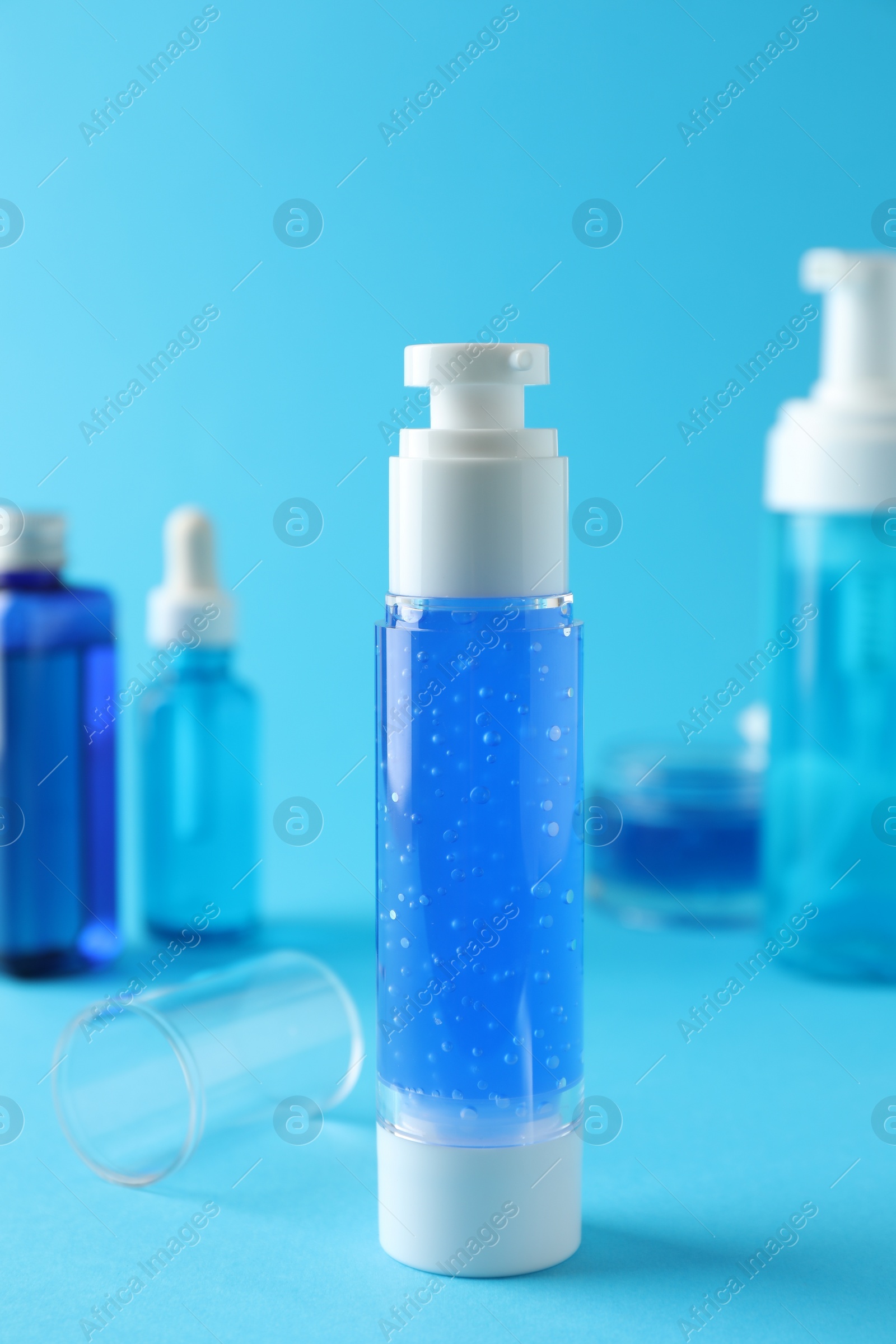 Photo of Different cosmetic products on light blue background