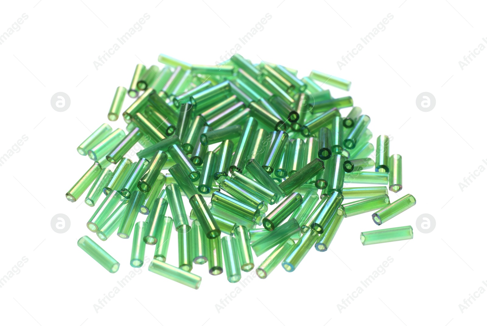 Photo of Pile of green bugle beads on white background