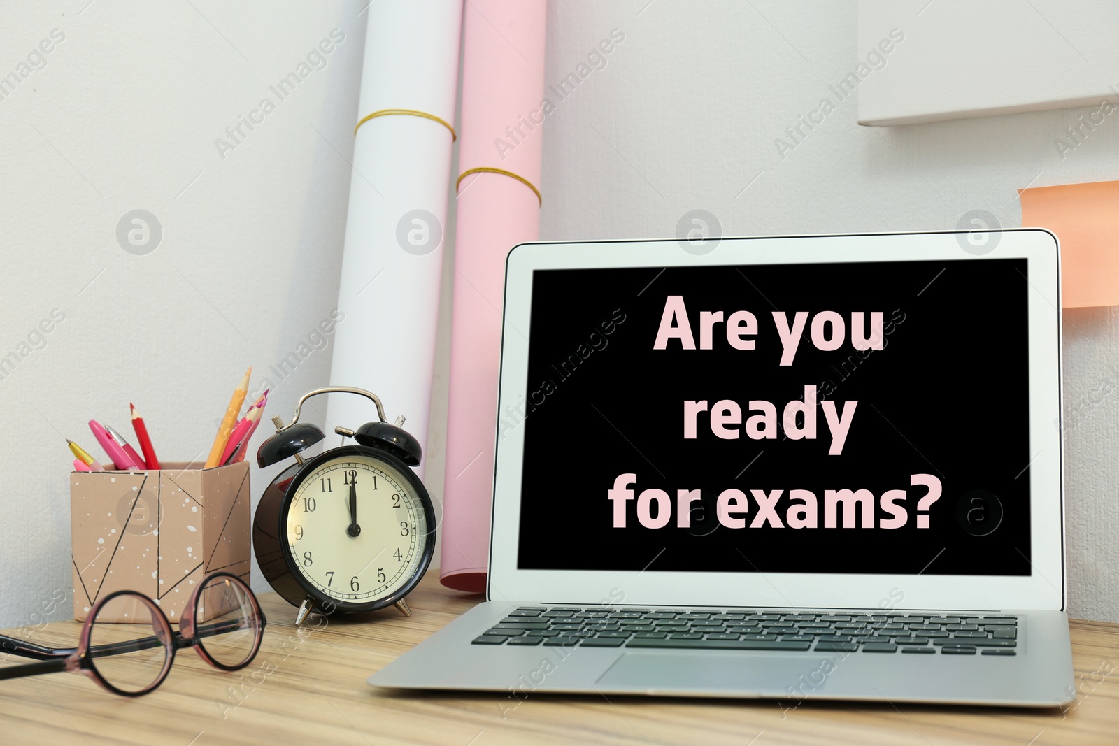 Image of Modern laptop with phrase ARE YOU READY FOR EXAMS indoors