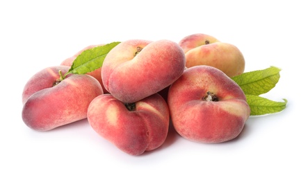 Photo of Fresh donut peaches with leaves on white background