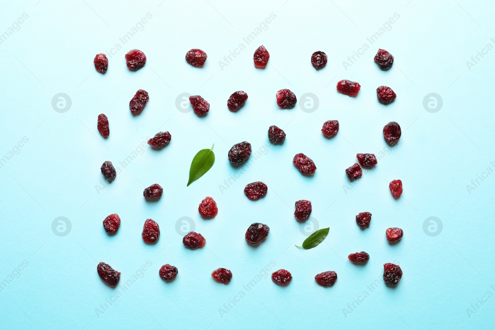 Photo of Flat lay composition of cranberries on color background. Dried fruit as healthy snack