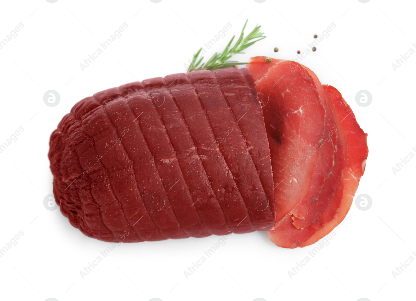 Photo of Tasty fresh dry bresaola, peppercorns and rosemary isolated on white, top view