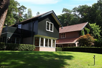 Picturesque view of beautiful house and plants on sunny day