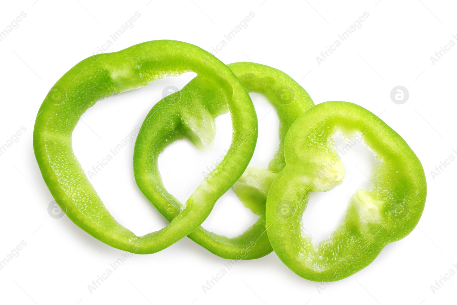 Photo of Slices of green bell pepper isolated on white