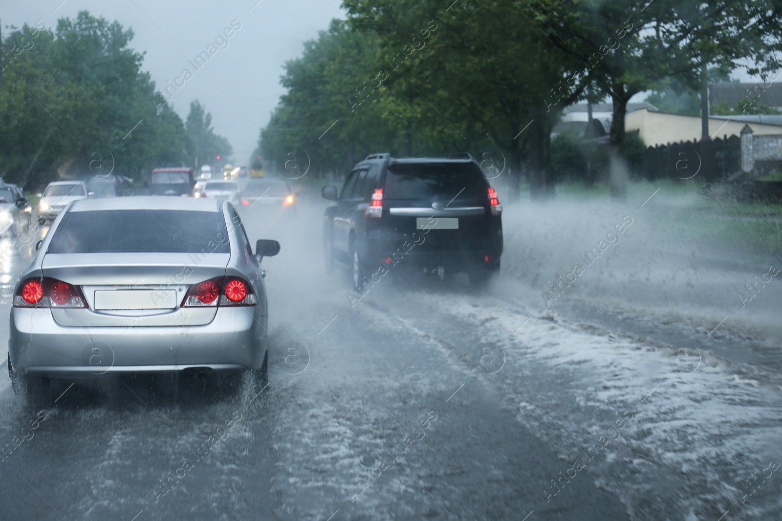 Photo of View of road with cars on rainy day