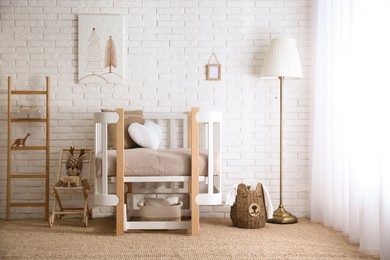 Photo of Baby room interior with toys and stylish furniture