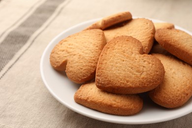 Photo of Heart shaped Danish butter cookies on table, closeup