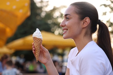 Photo of Lviv, Ukraine - September 26, 2023: Woman with McDonald's ice cream outdoors