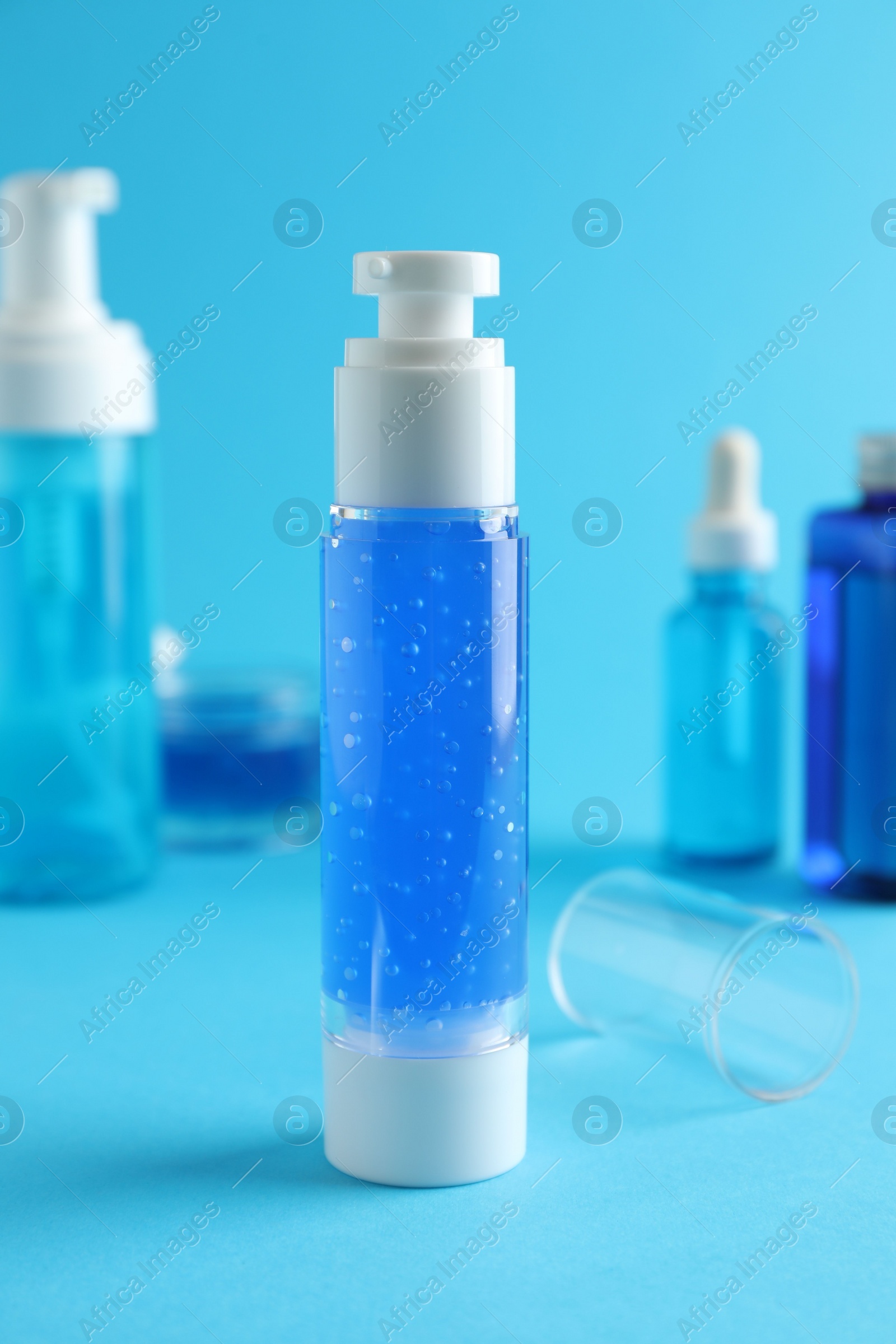 Photo of Different cosmetic products on light blue background