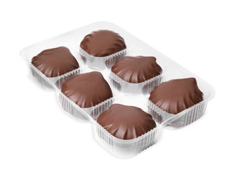 Photo of Delicious chocolate covered marshmallows in package on white background
