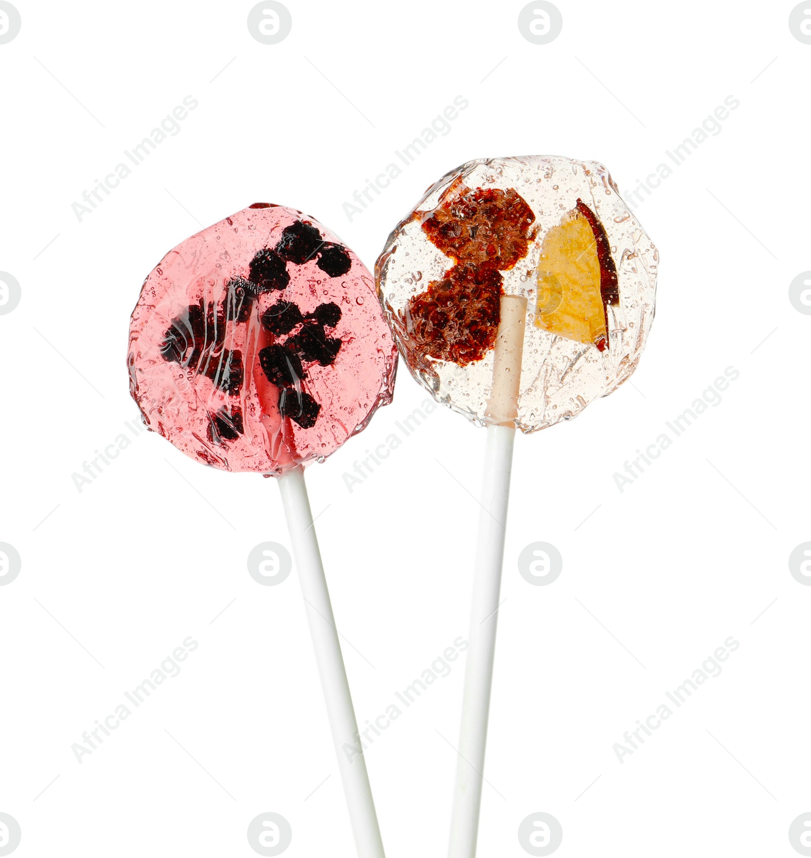 Photo of Sweet colorful lollipops with berries on white background