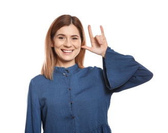 Woman showing I LOVE YOU gesture in sign language on white background