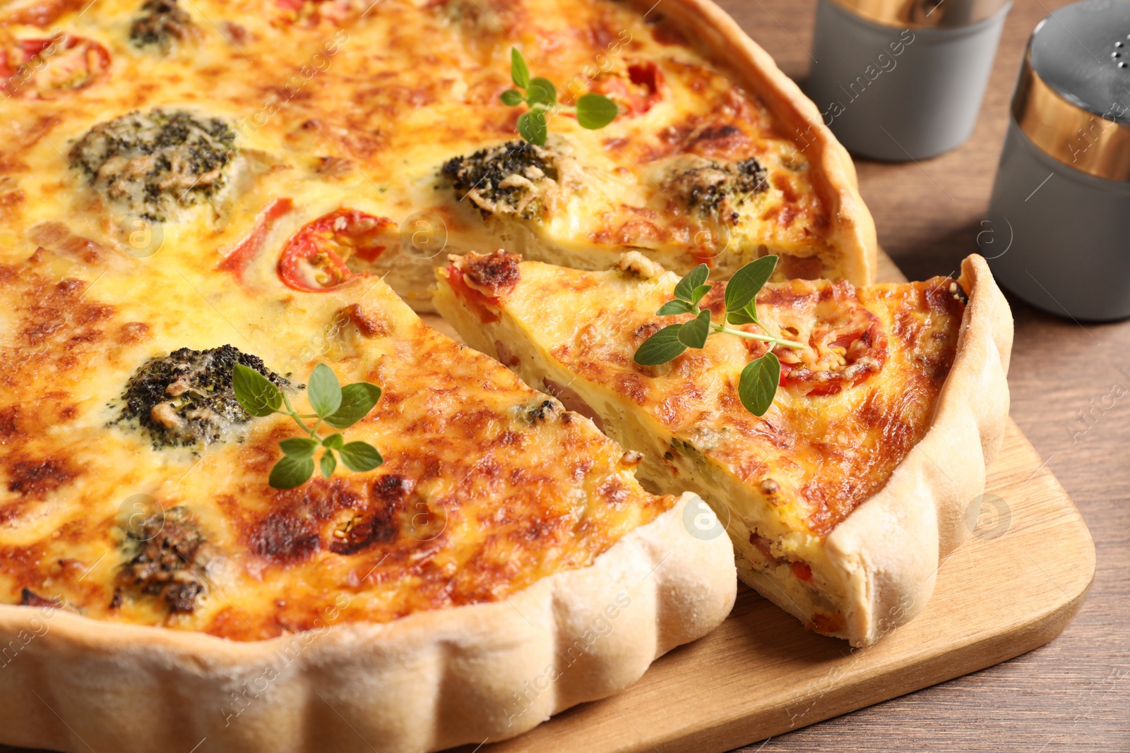 Photo of Delicious homemade vegetable quiche on table, closeup