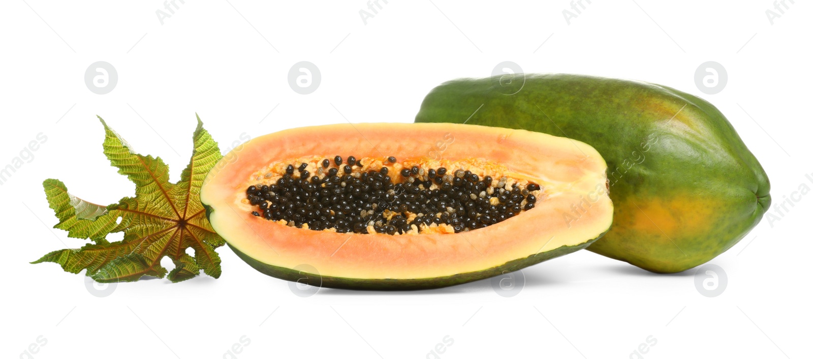 Photo of Fresh juicy ripe papayas with leaf on white background