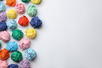 Photo of Colorful paper balls on white background, top view