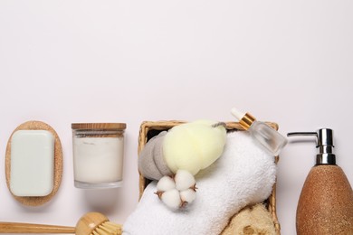 Bath accessories. Different personal care products and cotton flower on white background, flat lay with space for text