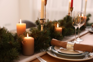Luxury place setting with beautiful festive decor for Christmas dinner on wooden table