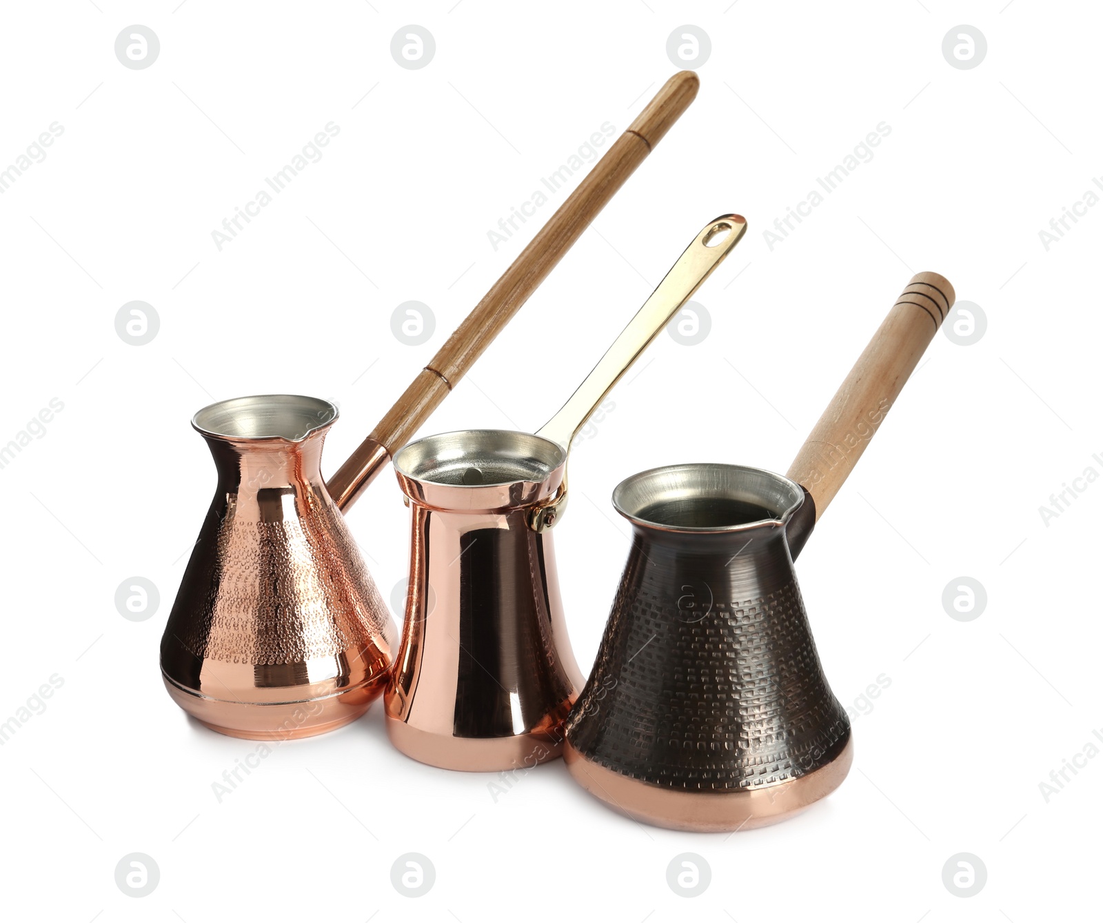 Photo of Set of different turkish coffee pots on white background